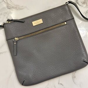 Kate Spade cross body bag. All leather. Grey. Zip pockets.